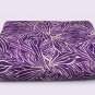 Missoni bedspreads with stylized leaves on purple colors for double bed