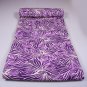 Missoni bedspreads with stylized leaves on purple colors for double bed