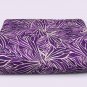 Missoni bedspreads with stylized leaves on purple colors for double bed