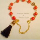 Red-Orange Coloral Bracelet with Black Silk Tassle Magnetic Clasp $49