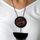 Necklace with two black shrink plastic pendants and chains
