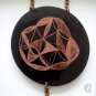 Necklace with two black shrink plastic pendants and chains