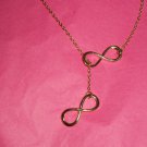 Gold tone Infinity Cross Pendant Necklace