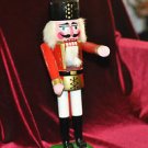 WOODEN NUTCRACKER WITH MOVEABLE ARMS 13 1/2''TALL 5''WIDE,,