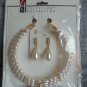 Christina Collection Three Strand Pearl Necklace and Dangling Earring Set Cream Steel in Gold Tone