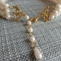 Christina Collection Three Strand Pearl Necklace and Dangling Earring Set Cream Steel in Gold Tone