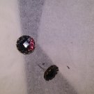 Glistening goth earrings.