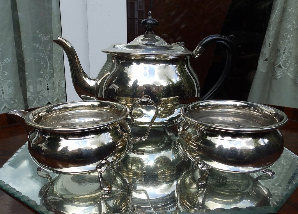 Antique Silver Plate: A three piece Teaset - early 20thC