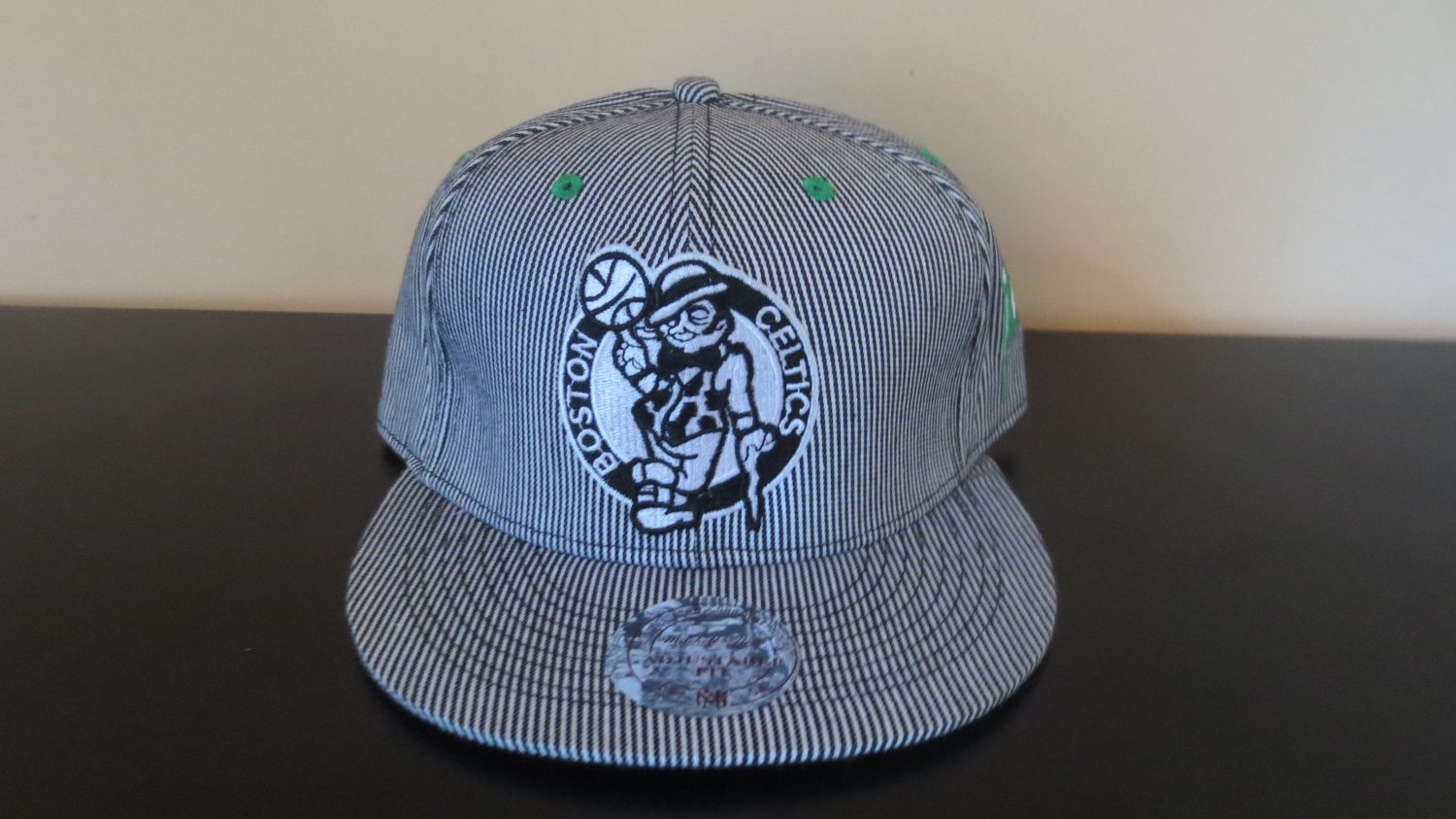 New Mitchell & Ness Boston Celtics Black/White Strip Strapback Hat