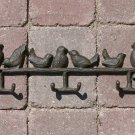 Coat Rack With Birds Perched.