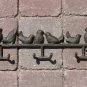 Coat Rack With Birds Perched.