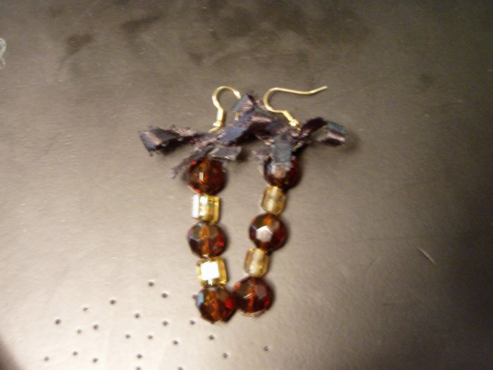 gold and brown with black bow