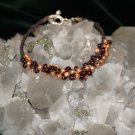 Brown Handcrafted Woven Hemp Bracelet with Garnet and Gold Glass Beads and Metal Charms
