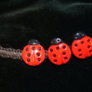 Handcrafted Black Hemp with 3 Ladybugs finished with a metal closure