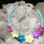 Blue Handcrafted Bracelet with 6 Multi-Colored Stars and Metal Closure