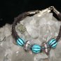 Black Handcrafted Hemp Bracelet with 3 Blue with 2 metal beads with a metal closure