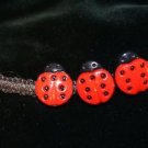 Black Handcrafted Bracelet with 3 Plastic LadyBug Buttons With Metal Closure