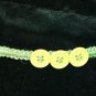 Green Handcrafted Hemp Bracelet with 3 Light Green Buttons w/ Metal Closure.
