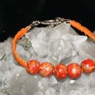 Orange Handcrafted Hemp with Orange Wooden Beads finished with a metal closure