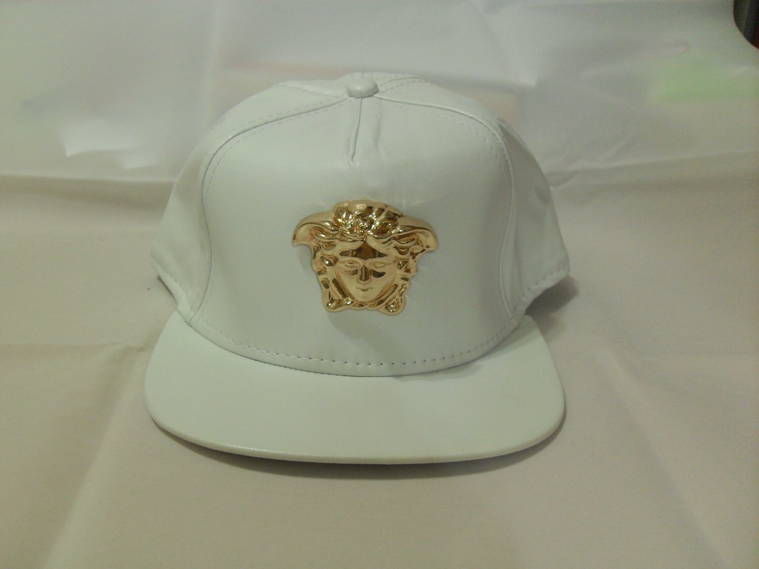 versace hat gold