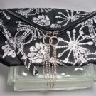 Erikson Beamon Cosmetic bag 10" X 7" Black & White with rhinestone zip pull