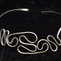 Waves in Motion Choker Shown in Nickle Silver.