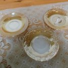 Three Peach Luster Fire King saucers