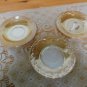 Three Peach Luster Fire King saucers