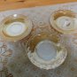 Three Peach Luster Fire King saucers