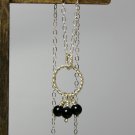 Sterling Silver Interlocking Twisted Rings with Hanging Black Onyx Pendant