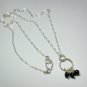 Sterling Silver Interlocking Twisted Rings with Hanging Black Onyx Pendant