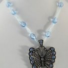 Light Blue Crystal Butterfly Necklace on Beaded Ribbon