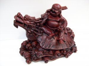 Laughing Buddha on Dragon
