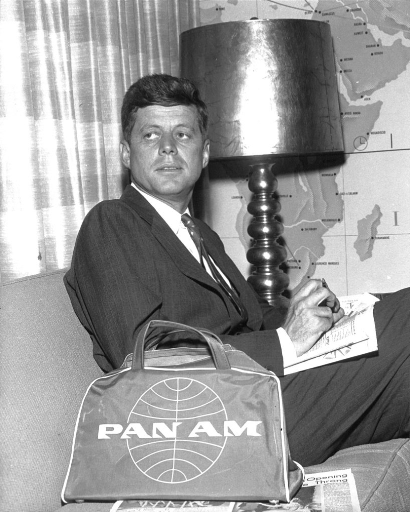 JOHN F. KENNEDY AWAITS FLIGHT IN PAN AM'S FIRST CLASS LOUNGE 8X10 PHOTO (AA-933)