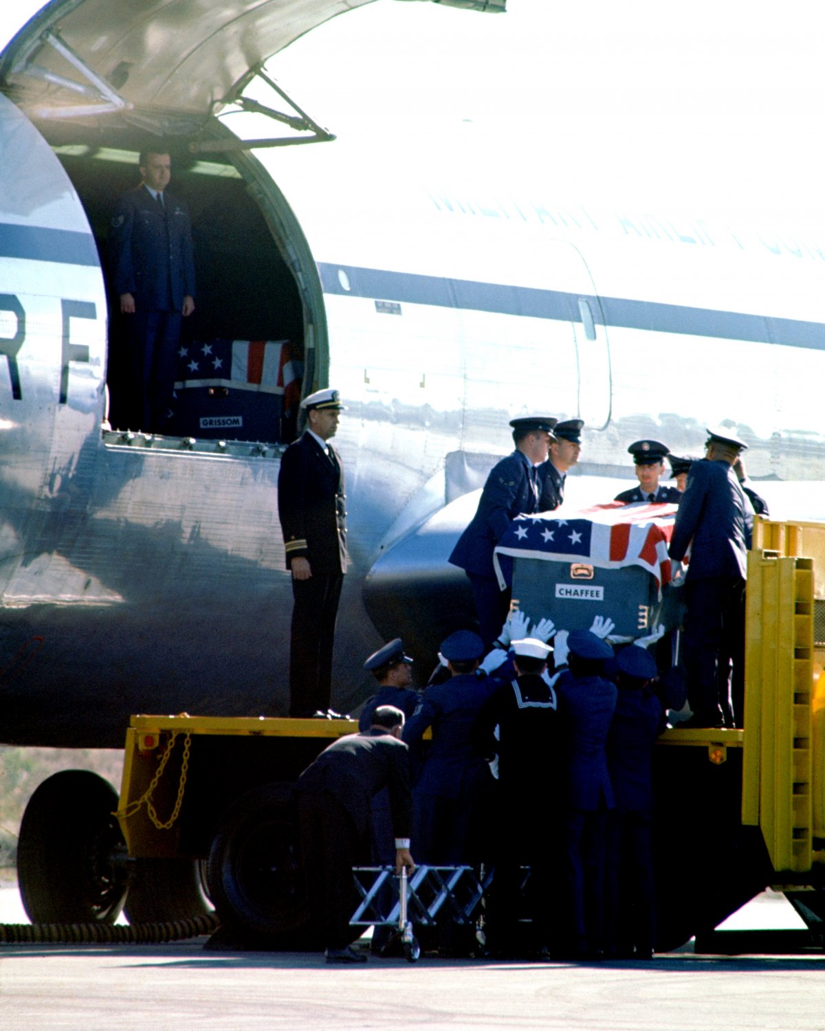 GUS GRISSOM ROGER CHAFFEE CASKETS ON KC-135 FOR TRANSPORT TO ARLINGTON ...