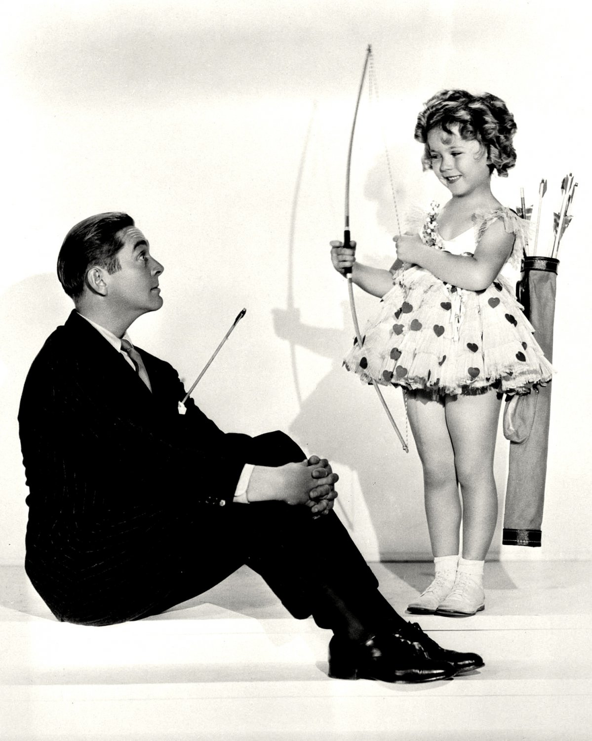 Shirley temple and warner baxter in stand up and cheer! 