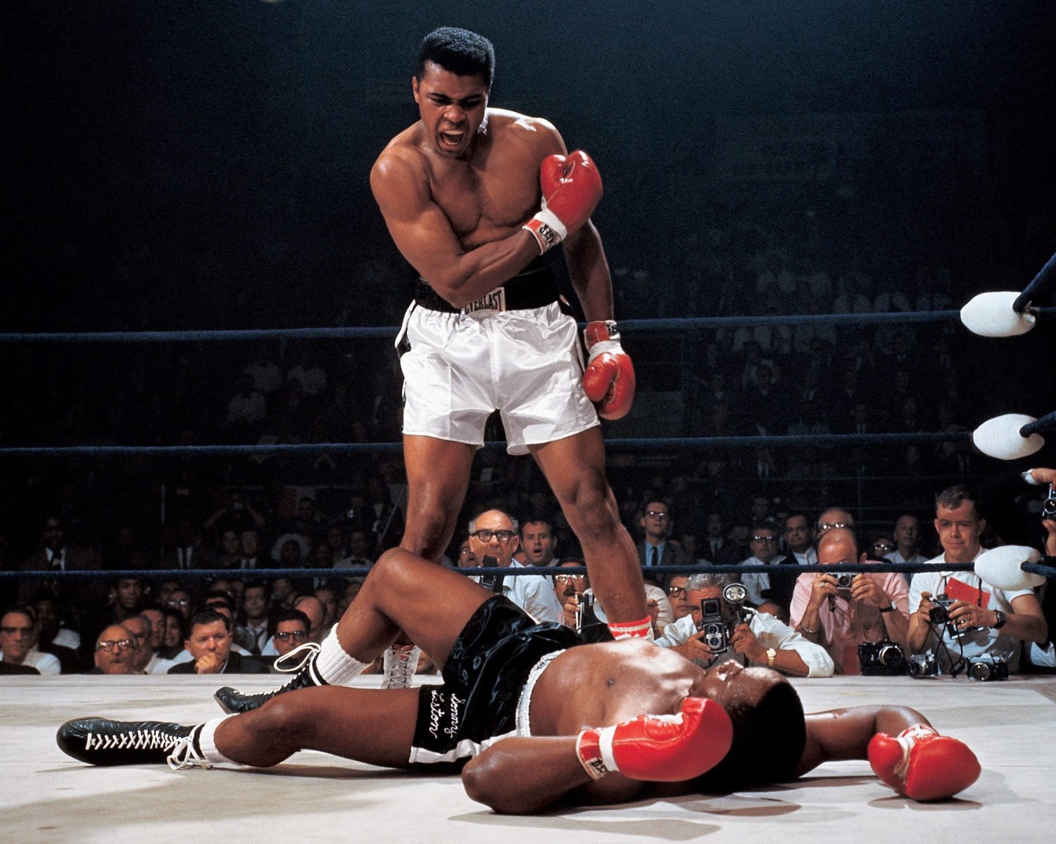 MUHAMMAD ALI STANDS OVER SONNY LISTON IN LEWISTON MAINE 1965 8X10 PHOTO (ZY-551)