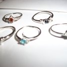 Various Size 6 Rhodium plated rings.  10 count