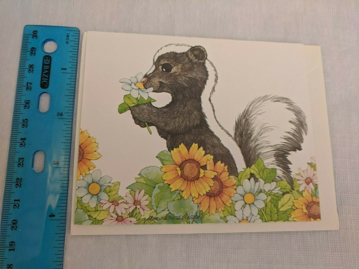 Current Inc Carefree Capers Note Card Skunk in Flowers by Ann Patrice Wilson