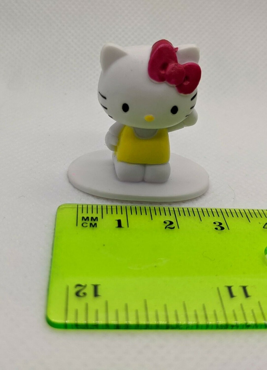 Sanrio Hello Kitty Mini Figurine Cake Topper 1.25" Yellow Dress, Pink Bow