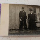 RPPC Old Picture Man & Woman Standing Outside in Hats, Coats Nicely Dressed