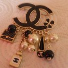 Chanel Gold Plated Charm Brooch Hallmarked Authentic. Preowned