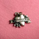 Sterling silver heart charm that states MOTHER