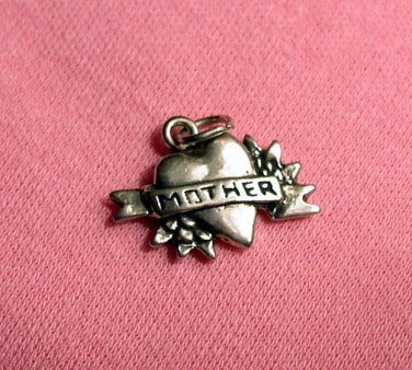 Sterling silver heart charm that states MOTHER