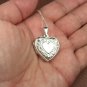 Sterling silver heart shaped Locket with decorative scrolls