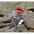 Silver ring motif bun carving with carnelian stone
