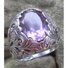 Silver ring flower bun motif with Amethys stone