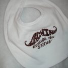 Staching through the snow embroidered Baby Bib - Brown lettering