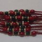 Ruby Red & Emerald Rakhi/Bracelet With Clear Crystal Stones Knotted With Beads