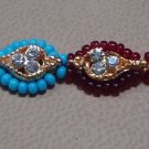 Dual Colored Rakhi in Turq & Ruby Red Beads & Threads With Crystals By Teknowear